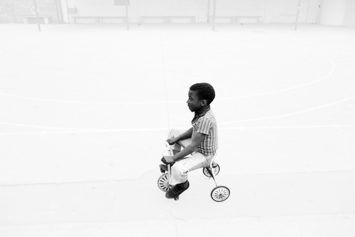 <span class="u-italic400">Boy tricycle</span><br>© Dennis Morris 